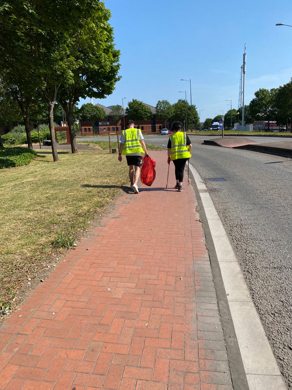 Two people doing litter picking