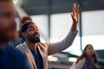 person raising their hand during a meeting