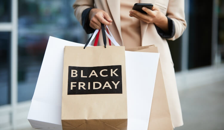 Shopping bags with black friday written on them
